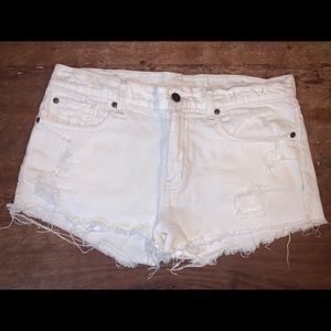 White denim distressed shorts